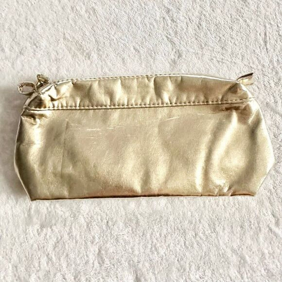 Clarins Handbags - White gold Clarins cosmetic zip up bag
